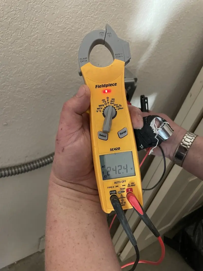 Voltage testing with clamp meter during Recessed Lighting Installation in Esopus